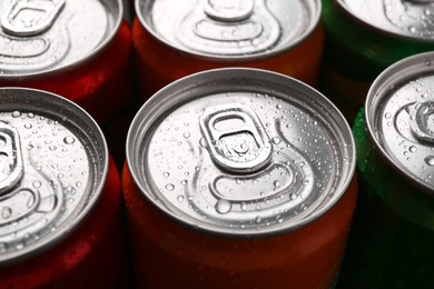 Photo of Energy drink in wet cans, closeup. Functional beverage