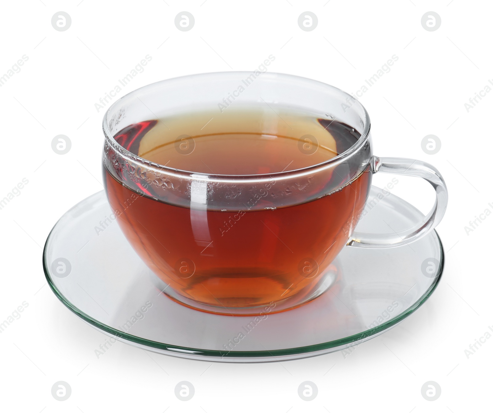 Photo of Aromatic tea in glass cup isolated on white