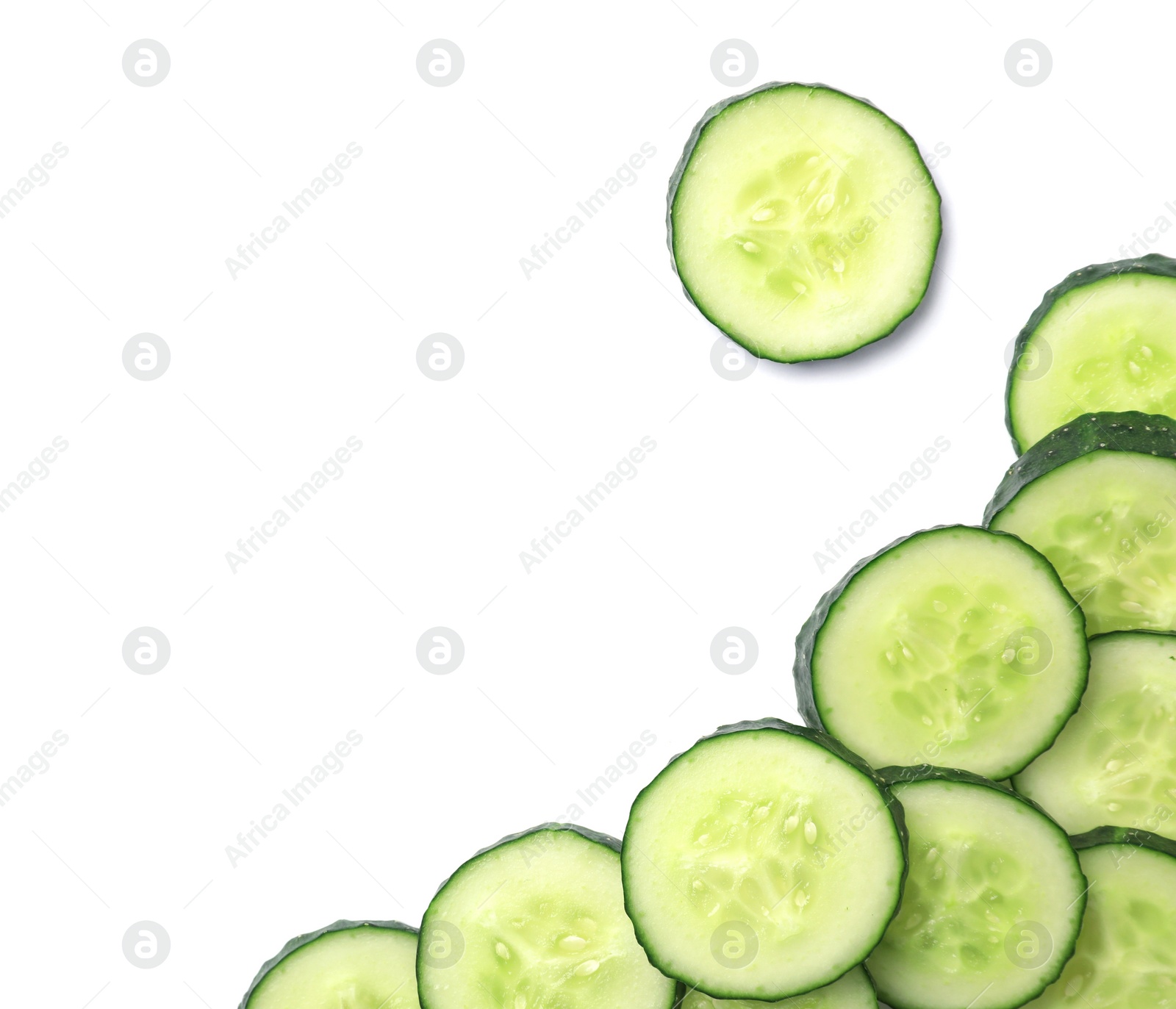 Photo of Slices of cucumbers on white background, top view