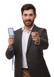 Smiling man with VIP pass badge on white background