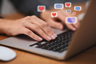 Young woman using laptop at table, closeup. Social media