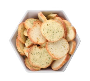 Crispy rusks with seasoning in bowl isolated on white, top view