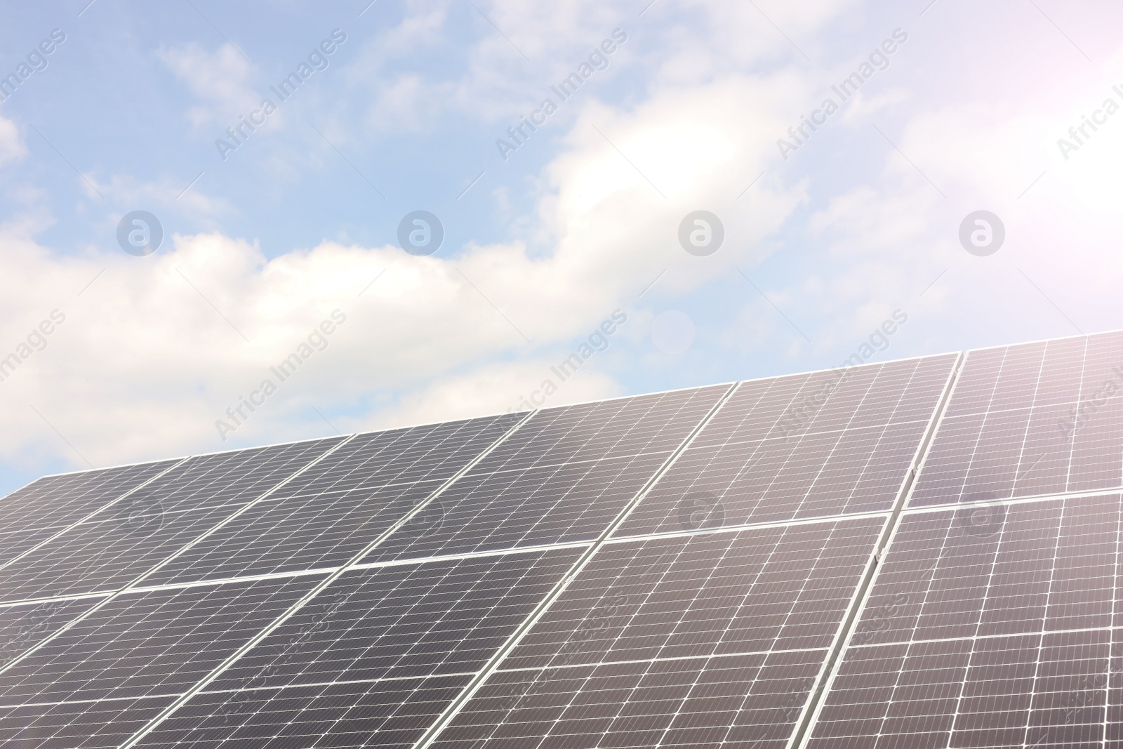 Photo of Solar panels outdoors on sunny day. Alternative energy