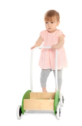 Photo of Cute baby playing with toy walker on white background