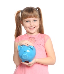 Photo of Portrait of little girl with piggy bank on white background