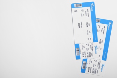 Photo of Avia tickets on white background, flat lay and space for text. Travel agency concept