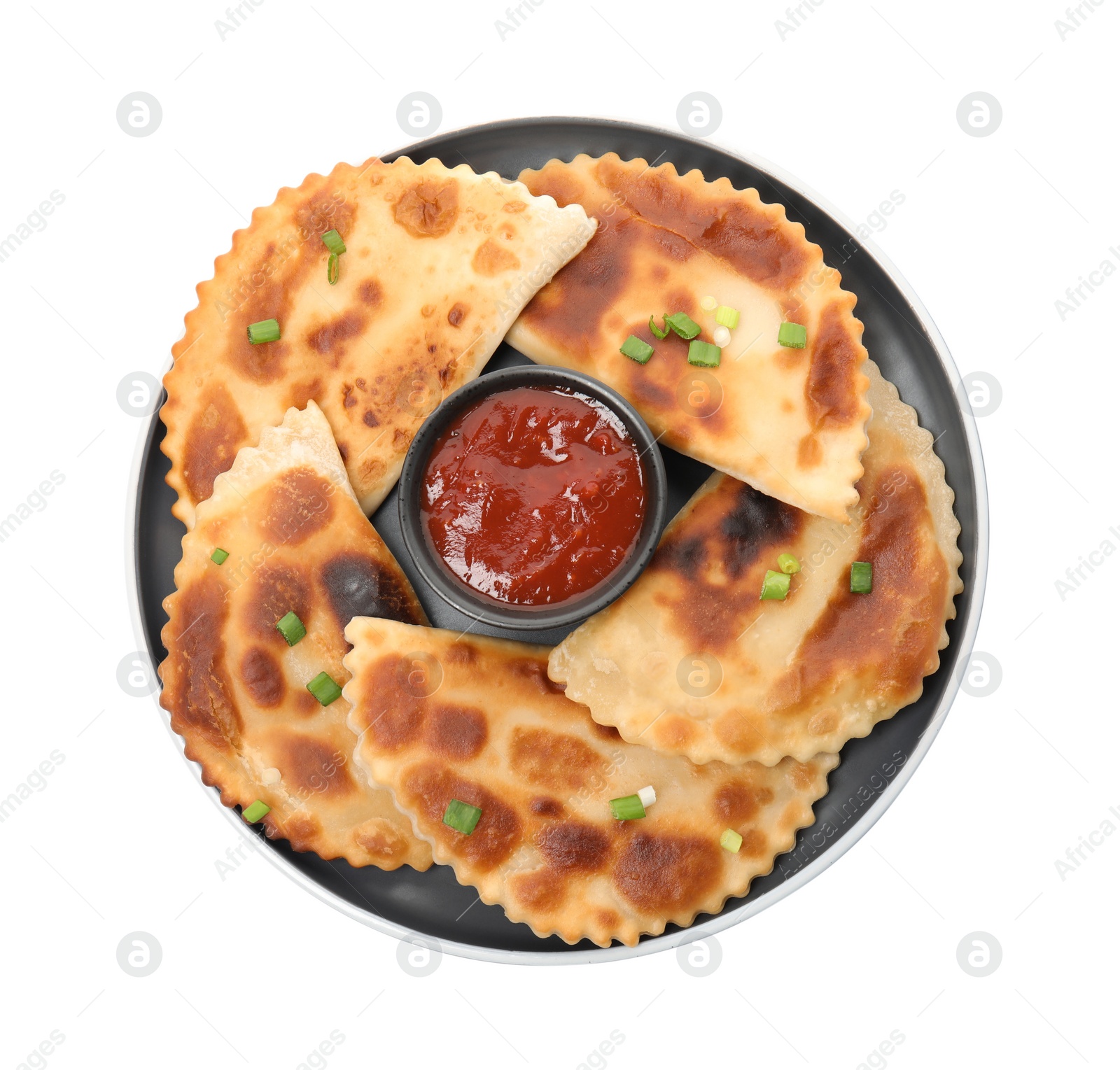 Photo of Delicious fried chebureki with ketchup isolated on white, top view