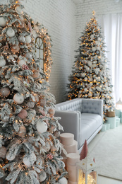 Photo of Beautiful interior of living room with decorated Christmas trees