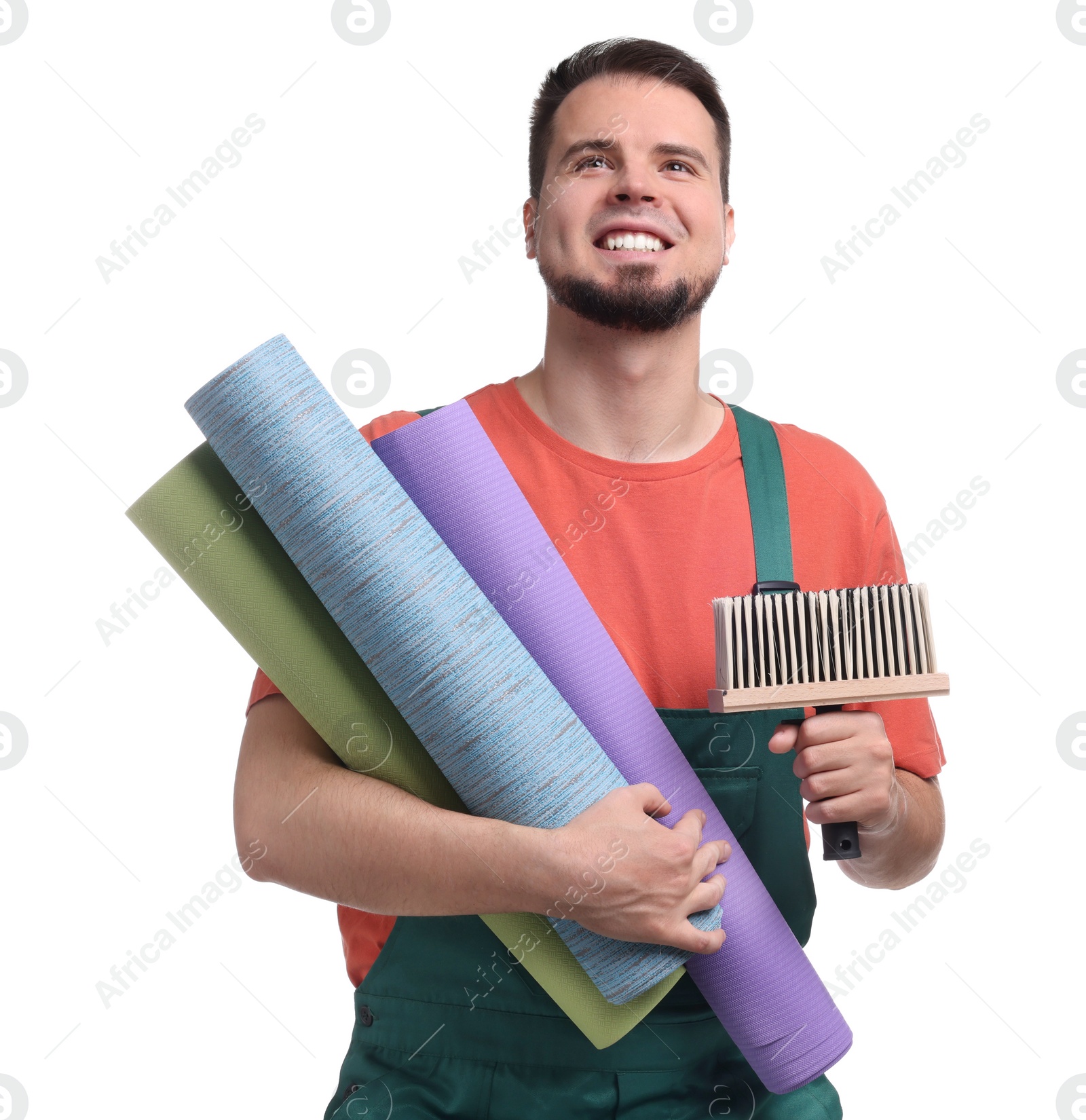 Photo of Man with wallpaper rolls and brush on white background