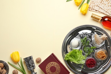 Flat lay composition with symbolic Passover (Pesach) items and meal on color background, space for text