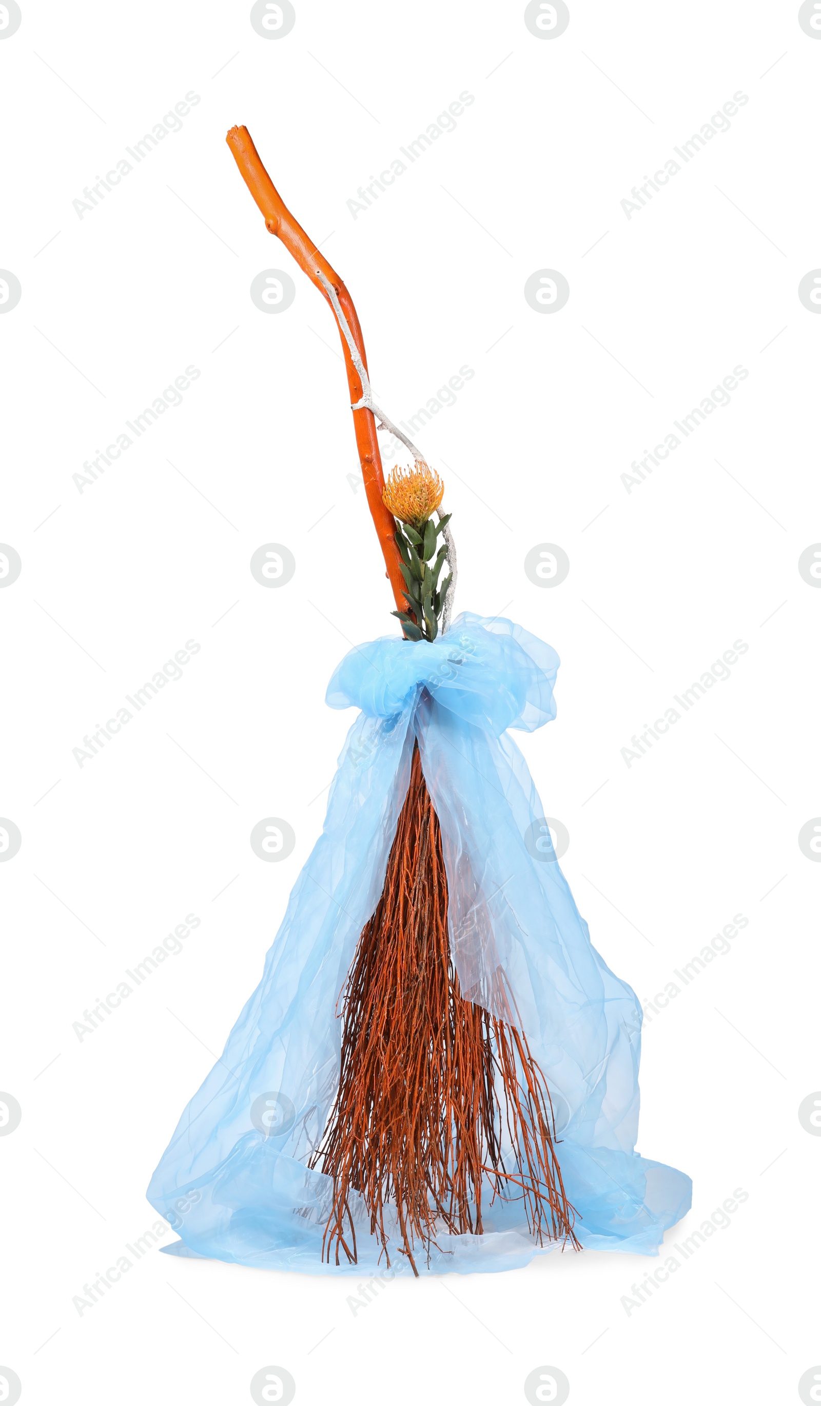 Photo of One beautiful witch's broom with tulle isolated on white