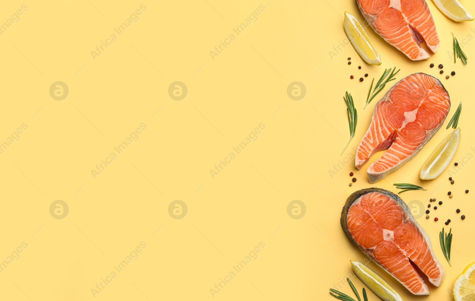 Photo of Flat lay composition with salmon steaks on yellow background. Space for text