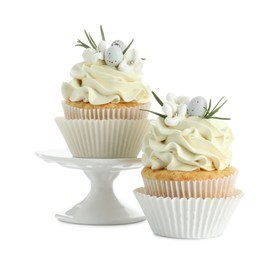 Photo of Tasty Easter cupcakes with vanilla cream isolated on white