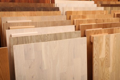 Photo of Many different samples of wooden flooring in store