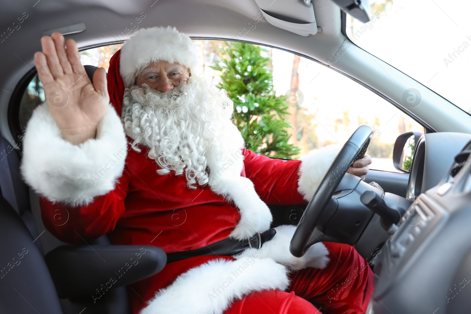 Photo of Authentic Santa Claus driving car, view from inside