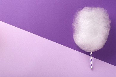 Photo of One sweet cotton candy on color background, flat lay. Space for text