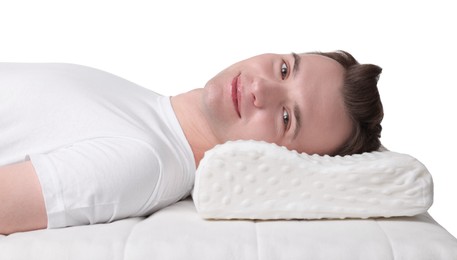 Photo of Man lying on orthopedic pillow against white background