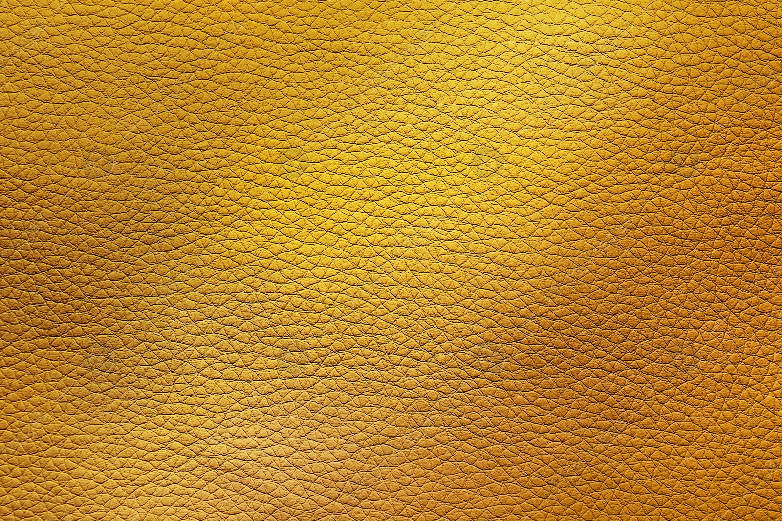 Image of Golden textured surface as background, closeup view