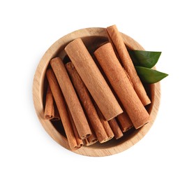 Photo of Cinnamon sticks and green leaves in bowl isolated on white, top view