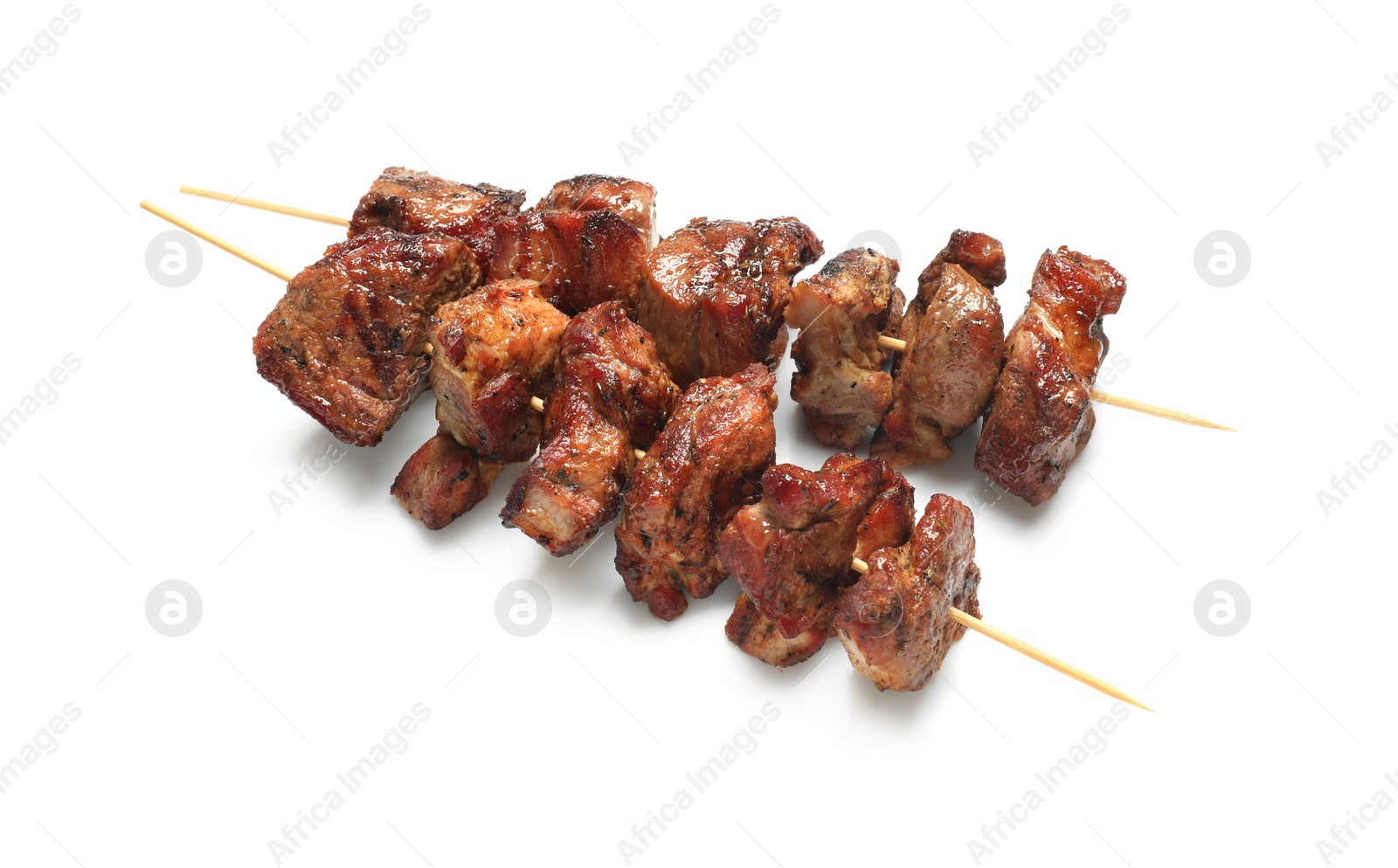 Photo of Wooden skewers with delicious shish kebabs isolated on white