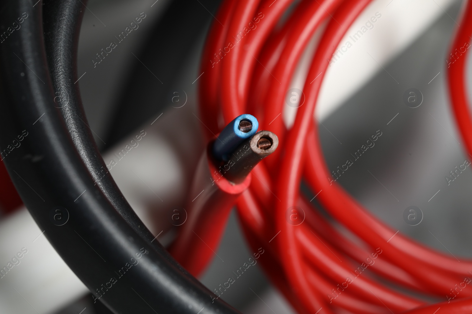 Photo of Colorful electrical wire on blurred background, closeup