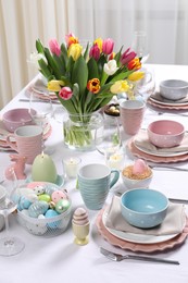 Photo of Festive table setting with beautiful flowers. Easter celebration