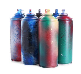 Photo of Many spray paint cans isolated on white