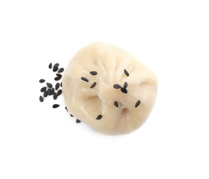 Tasty baozi dumpling with sesame seeds on white background, top view