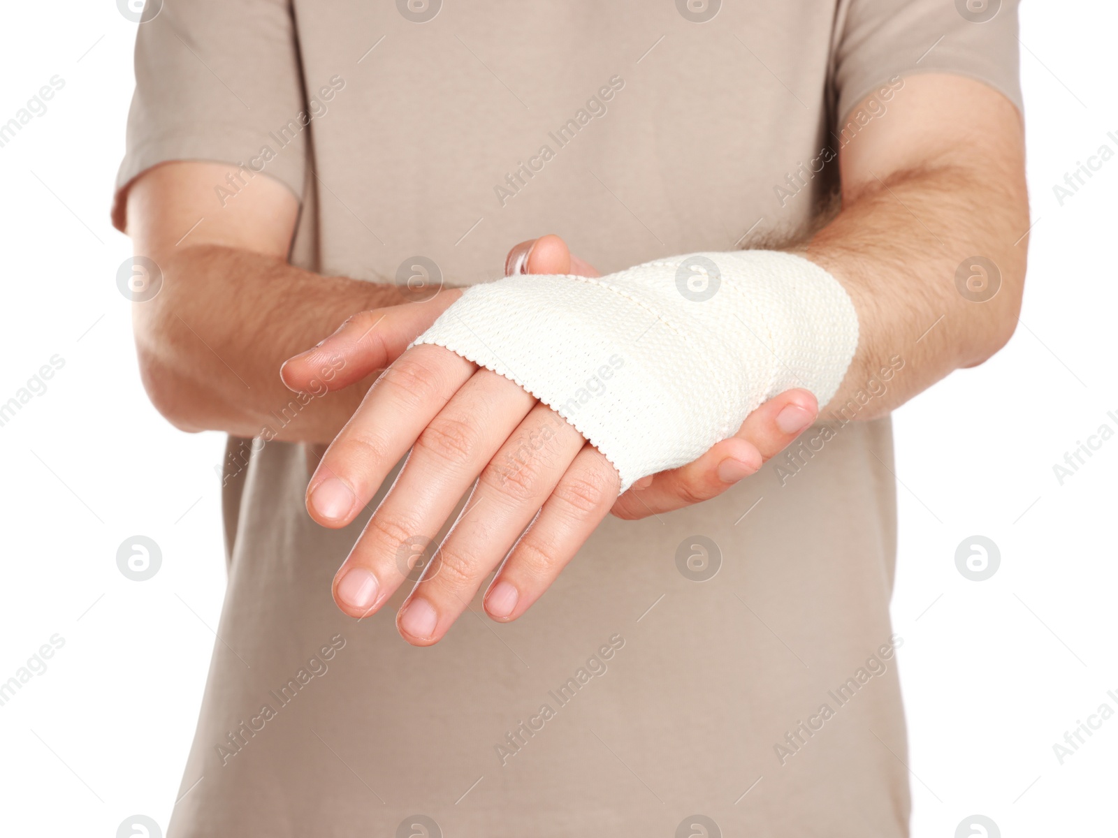 Photo of Man with hand wrapped in medical bandage on white background, closeup