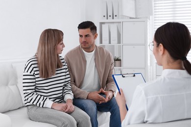 Photo of Couple having appointment with STD specialist in clinic