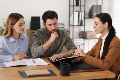 Couple having meeting with lawyer in office