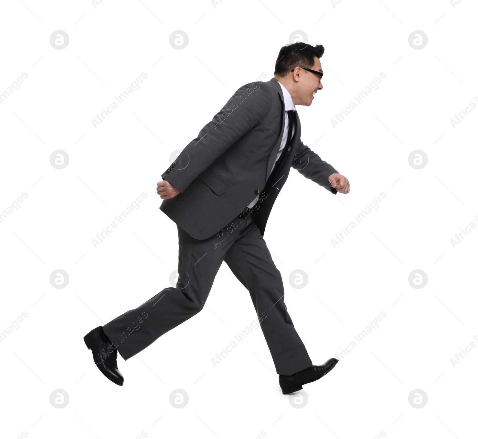 Photo of Businessman in suit running on white background