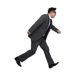 Businessman in suit running on white background