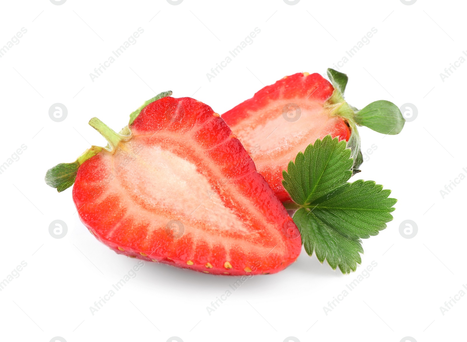 Photo of Halves of delicious strawberry and green leaf on white background