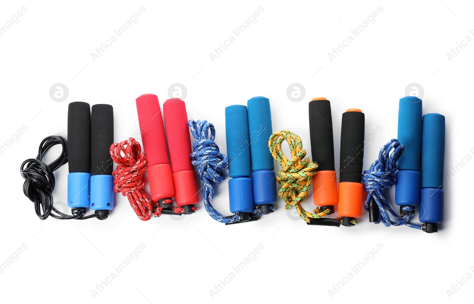 Photo of Set of jump ropes on white background, top view