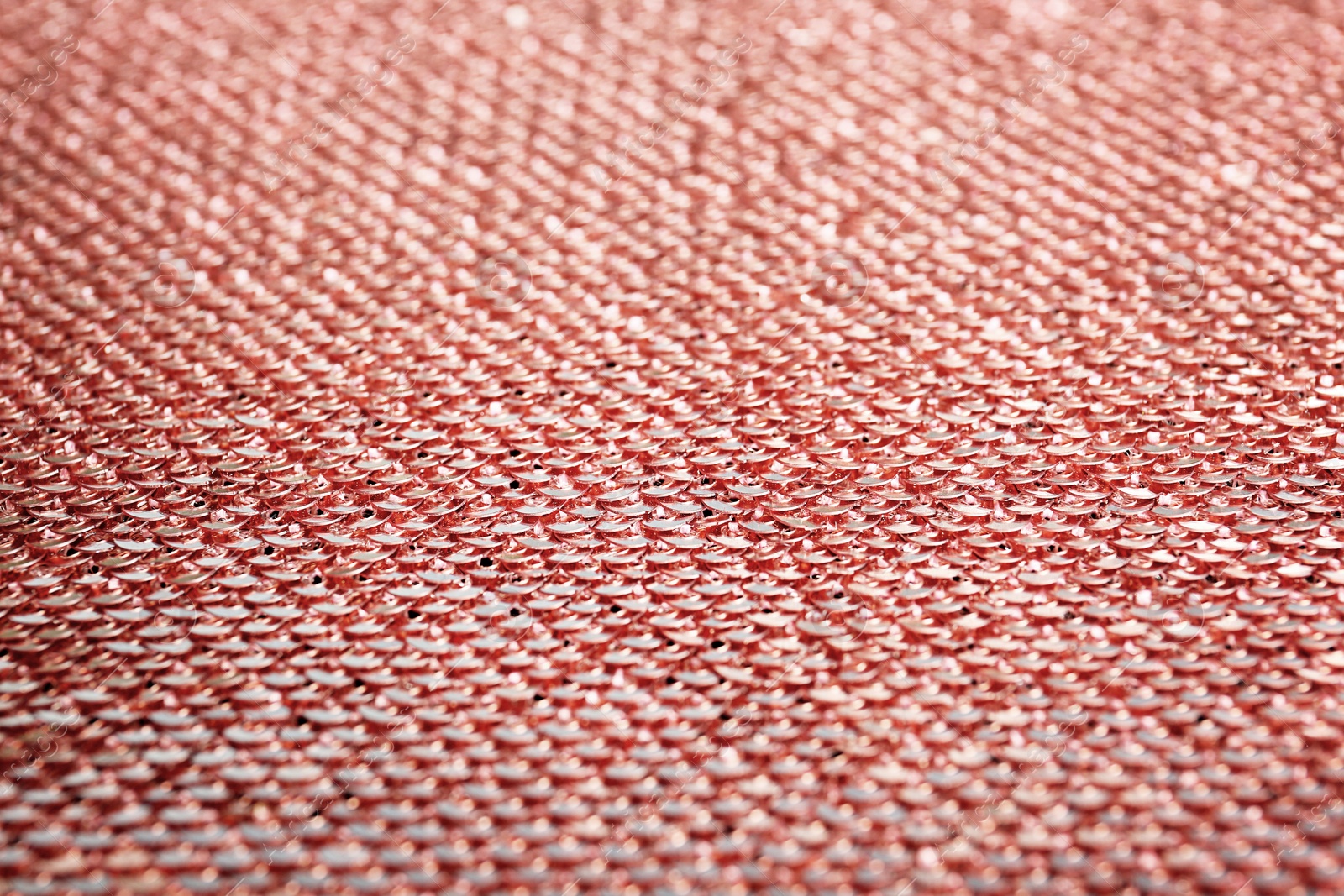 Photo of Rose paillettes on fabric as background, closeup