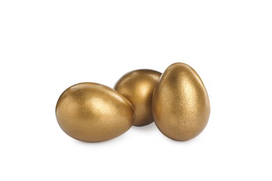 Many shiny golden eggs on white background