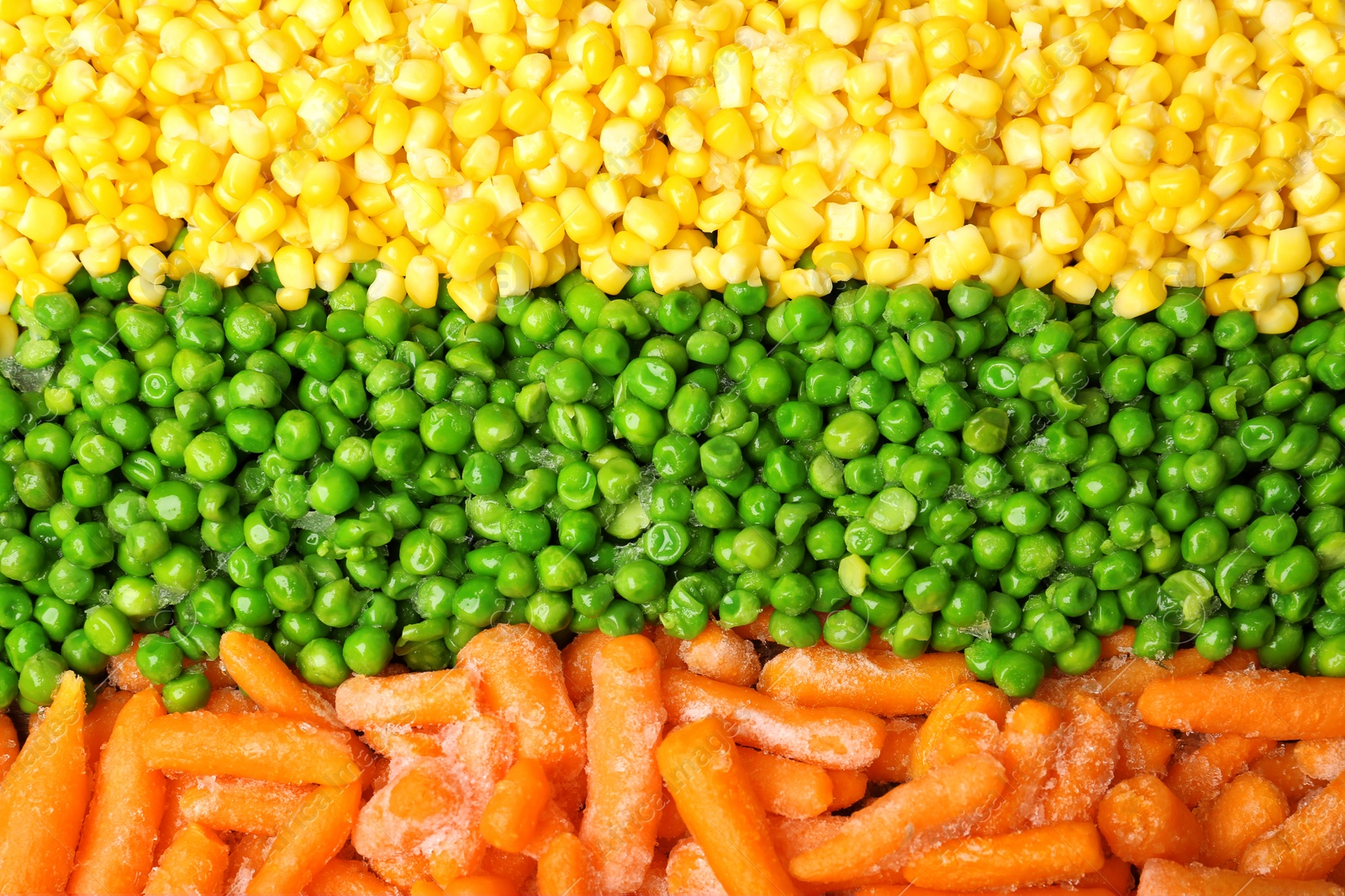 Photo of Mix of frozen vegetables as background, top view