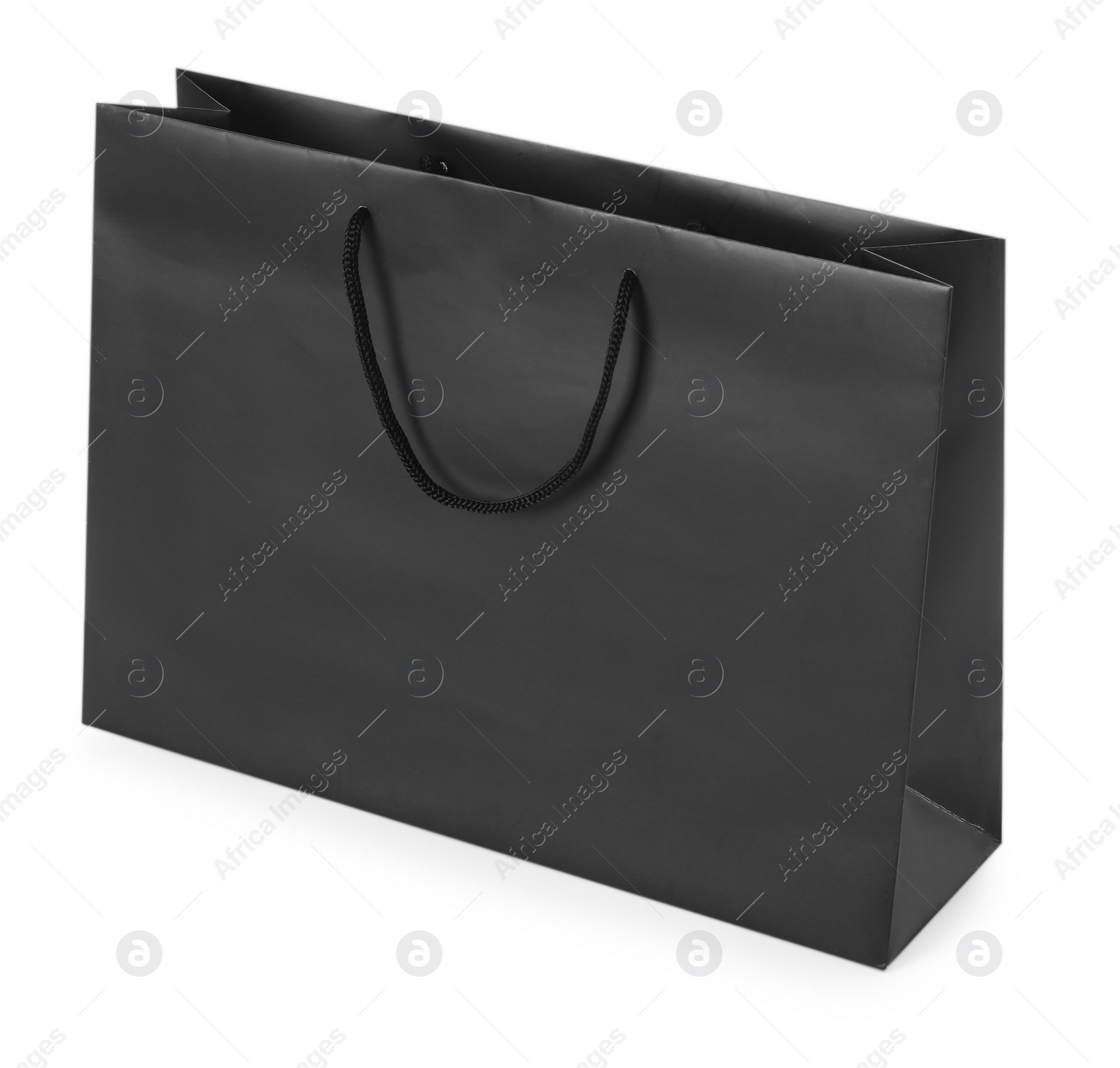 Photo of One black paper bag isolated on white