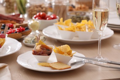 Photo of Variety of snacks on wooden table in buffet style