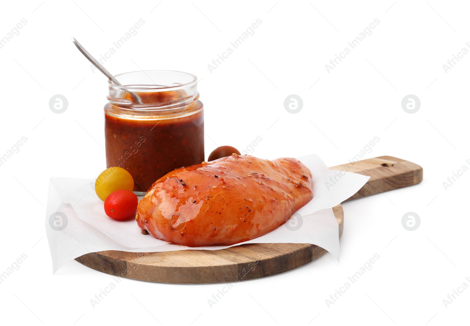 Photo of Fresh marinade and raw chicken fillets isolated on white