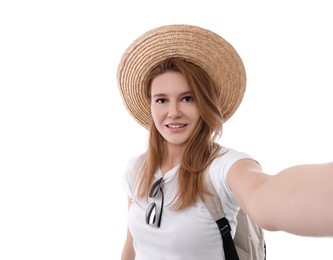 Beautiful woman in straw hat taking selfie on white background