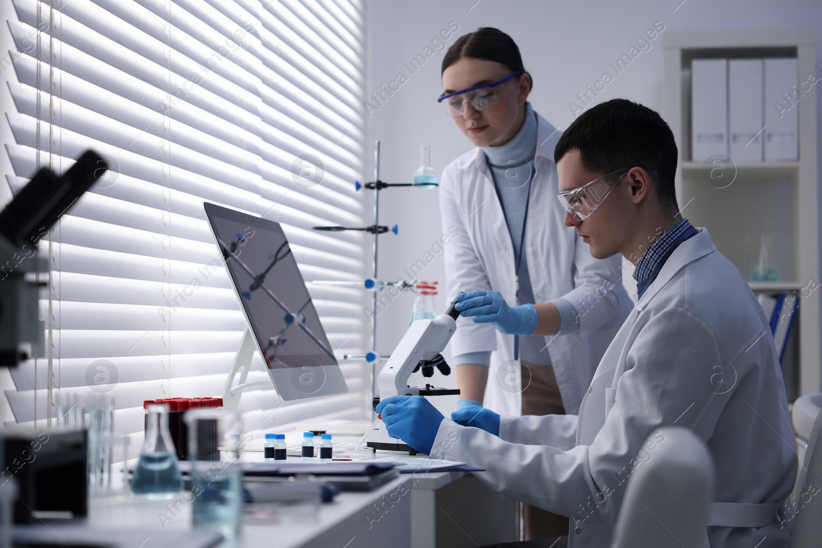 Photo of Scientists working with samples in laboratory. Medical research