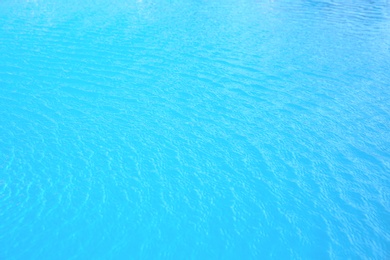 Swimming pool with clear water as background, closeup
