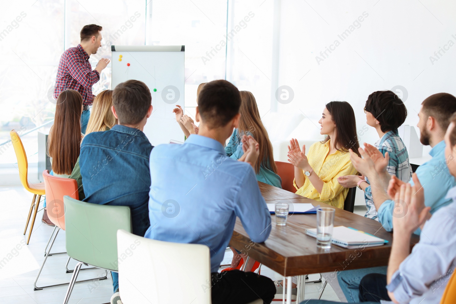 Photo of Male business trainer giving lecture in office