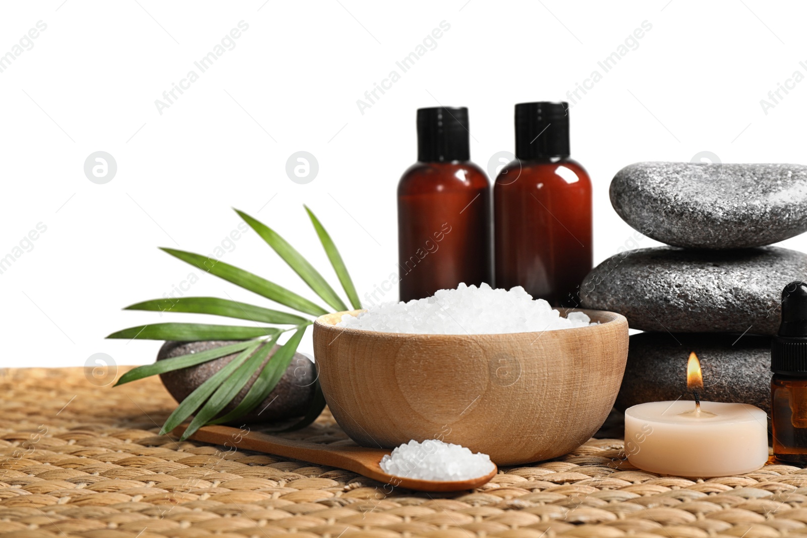 Photo of Beautiful spa composition with bath salt on wicker mat