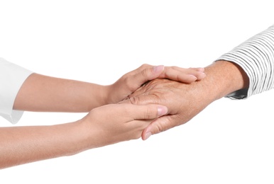Photo of People holding hands together on white background. Help and elderly care service