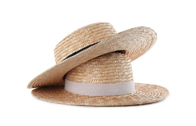 Photo of Straw hats isolated on white. Stylish accessory