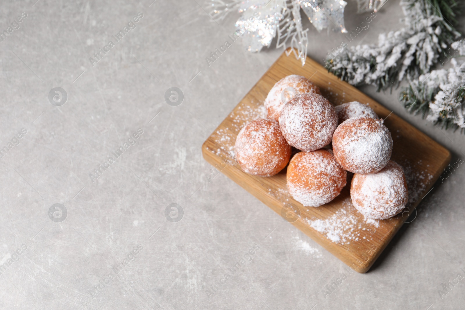 Photo of Delicious sweet buns and decor on gray table, flat lay. Space for text