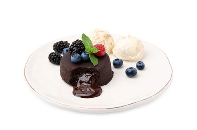 Plate with delicious chocolate fondant, berries, mint and ice cream isolated on white